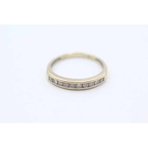 202 - 9ct gold diamond set ten stone eternity ring (1.5g) Size M 1/2