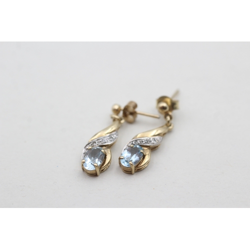 218 - 9ct gold blue topaz set drop earrings (1.8g)