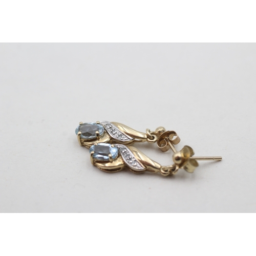 218 - 9ct gold blue topaz set drop earrings (1.8g)