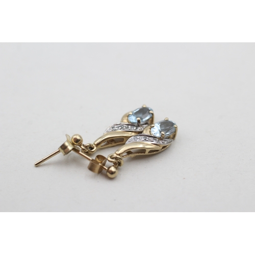 218 - 9ct gold blue topaz set drop earrings (1.8g)