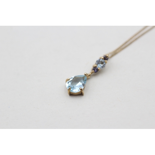 225 - 9ct gold blue topaz and iolite set pendant necklace (1.7g)