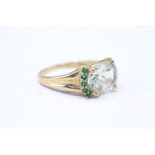 242 - 9ct gold prusiolite and emerald set ring (3.6g) Size P