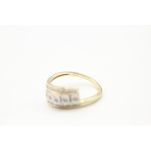 26 - 9ct gold diamond bypass twist ring (2.6g) Size Q