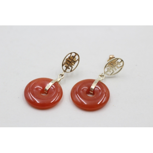 27 - 14ct gold red jade carved circle earrings (3.8g)