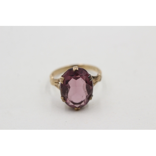 34 - 9ct gold purple paste single stone ring (3.9g) Size Q