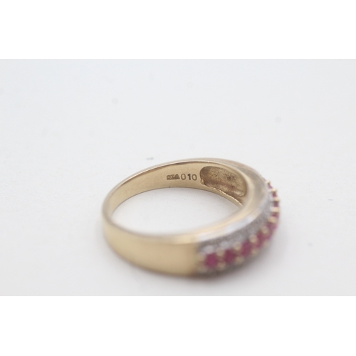 37 - 9ct gold diamond and ruby set half hoop eternity ring (4g) Size P