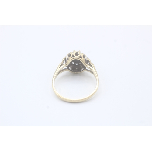 67 - 9ct gold diamond & sapphire oval cluster ring (2.3g) Size N