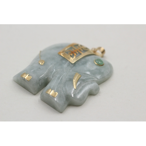 9 - 14ct gold jadite carved elephant pendant (19.4g)