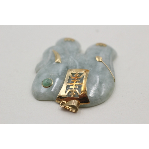 9 - 14ct gold jadite carved elephant pendant (19.4g)