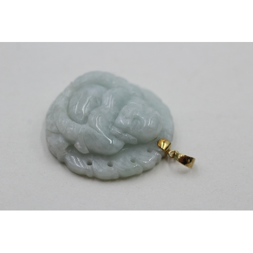 98 - 14ct gold jade carved buddha pendant (16.5g)