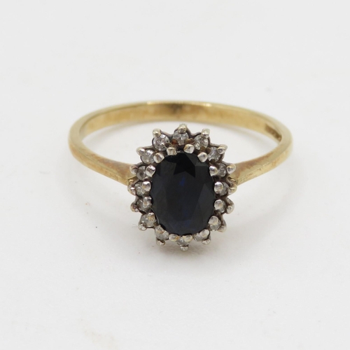 183 - 9ct gold diamond and sapphire halo ring (2.1g) Size N