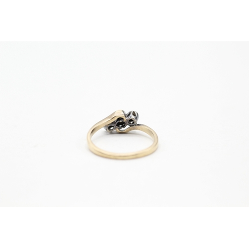 108 - 9ct gold three stone diamond ring (1.8g) Size M