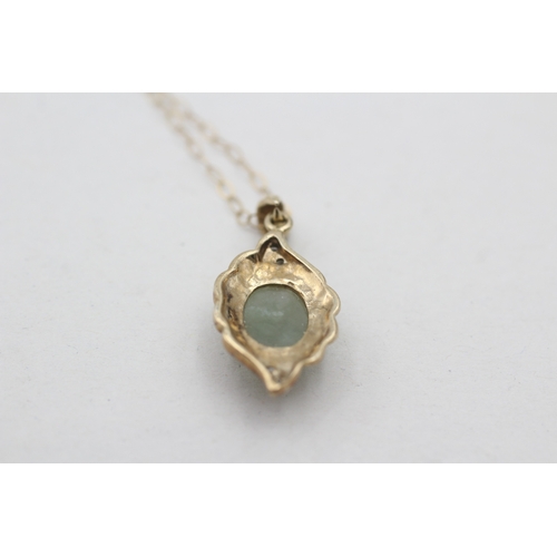 128 - 9ct gold diamond and jade pendant necklace (2.3g)