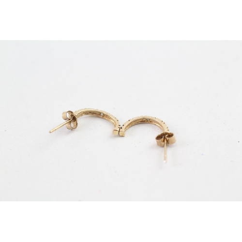 139 - 9ct gold diamond c-hoop earrings (0.9g)