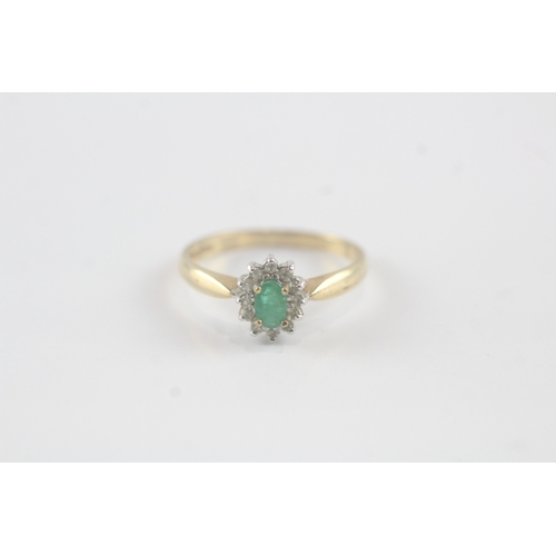 140 - 9ct gold emerald and diamond halo ring (1.7g) Size N