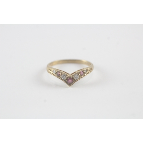 142 - 9ct gold ruby and diamond chevron ring (1.8g) Size N