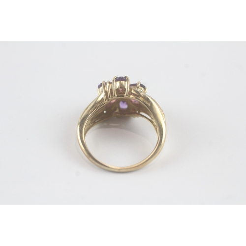 143 - 9ct gold diamond, amethyst, garnet and tourmaline dress ring (4.5g) Size M