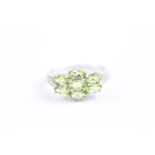 161 - 9ct gold oval cut peridot dress ring (2.4g) Size N