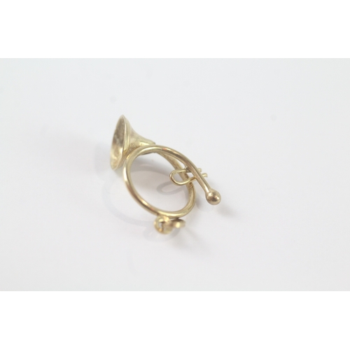 172 - 9ct gold trumpet charm (0.9g)