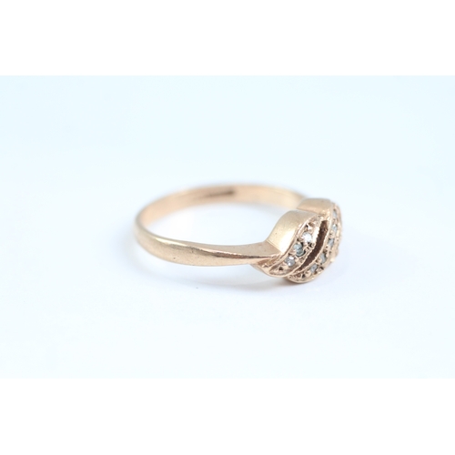 177 - 9ct gold diamond twist ring (2.8g) Size M