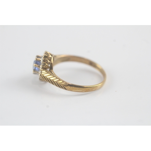 184 - 9ct gold diamond and sapphire halo ring (1.9g) Size M