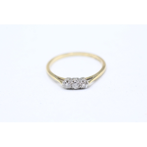 195 - 18ct gold and platinum diamond trilogy ring (1.5g) Size M