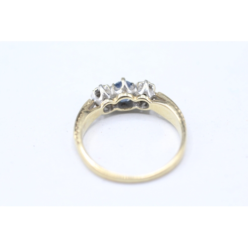 20 - 9ct gold illusion set diamond and sapphire trilogy ring (2.3g) Size M