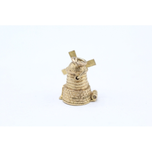 27 - 9ct gold opening windmill charm (2.6g)