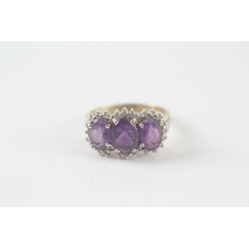 34 - 9ct gold three stone amethyst and diamond ring (2.9g) Size M