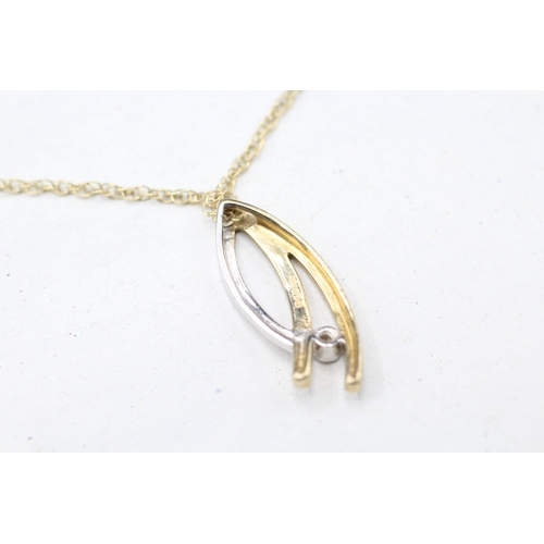 42 - 9ct gold bi colour diamond set pendant with chain (1.8g)