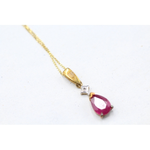 55 - 9ct gold diamond and ruby set pendant and chain (1g)