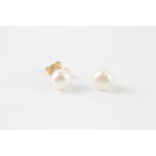 74 - 14ct gold cultured pearl stud earrings (1.3g)