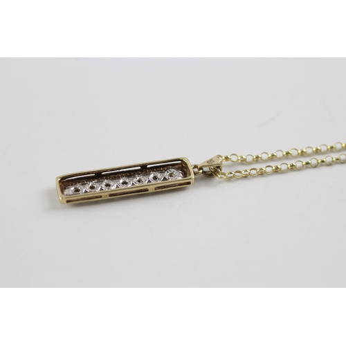 89 - 9ct gold diamond row pendant on chain (2.4g)