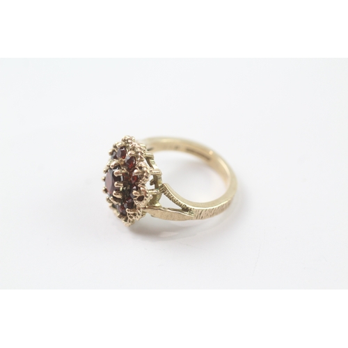 96 - 9ct gold garnet cluster cocktail ring (5.2g) Size K