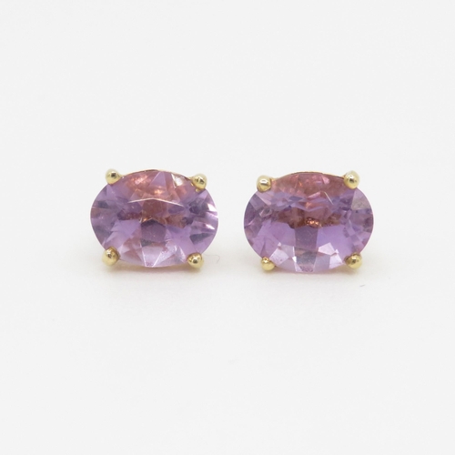 109 - 14ct gold amethyst stud earrings (1.7g)