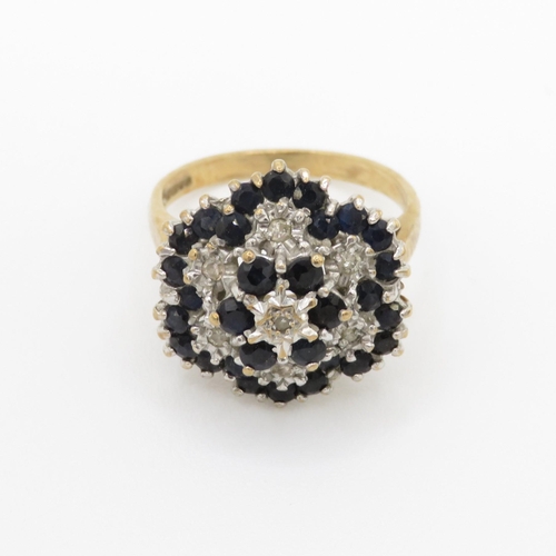 29 - 9ct gold diamond and sapphire set cluster ring (4.9g) Size N