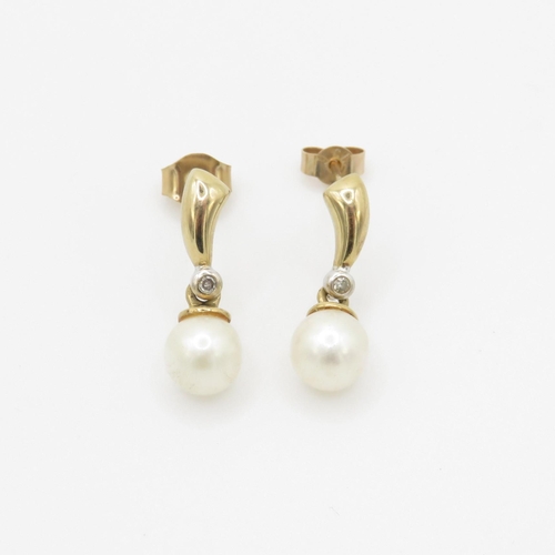 62 - 9ct gold diamond and cultured pearl drop earrings (1.8g)