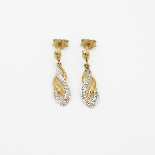 93 - 9ct gold diamond twist drop earrings (1.9g)