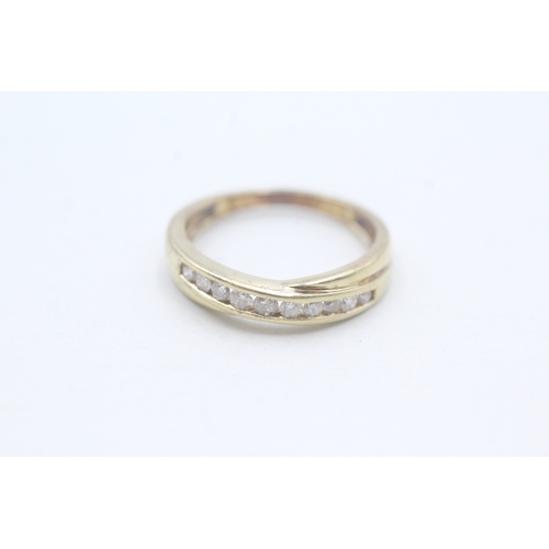 103 - 9ct gold diamond set eternity ring (1.9g) Size L