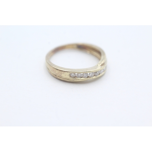 103 - 9ct gold diamond set eternity ring (1.9g) Size L