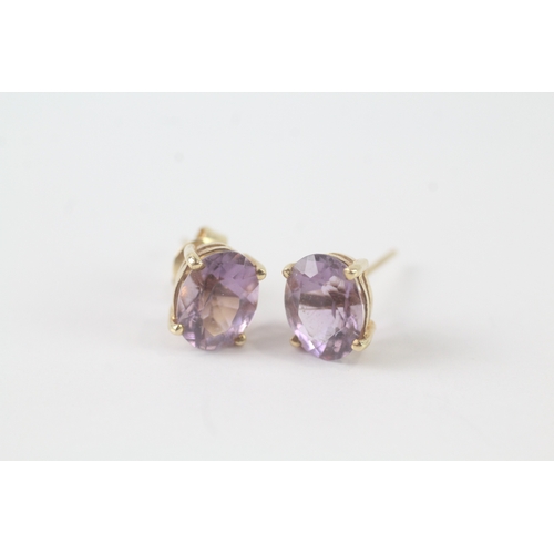 109 - 14ct gold amethyst stud earrings (1.7g)