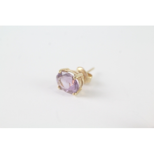 109 - 14ct gold amethyst stud earrings (1.7g)