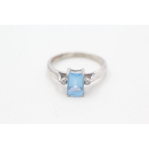 116 - 9ct white gold diamond and blue topaz dress ring (2.5g) Size M 1/2