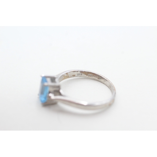 116 - 9ct white gold diamond and blue topaz dress ring (2.5g) Size M 1/2