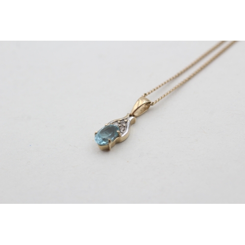 117 - 9ct gold diamond and blue gemstone set pendant necklace (1.7g)