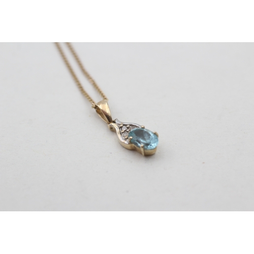 117 - 9ct gold diamond and blue gemstone set pendant necklace (1.7g)