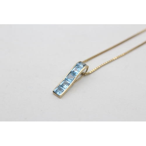 119 - 9ct gold blue topaz set pendant necklace (1.8g)