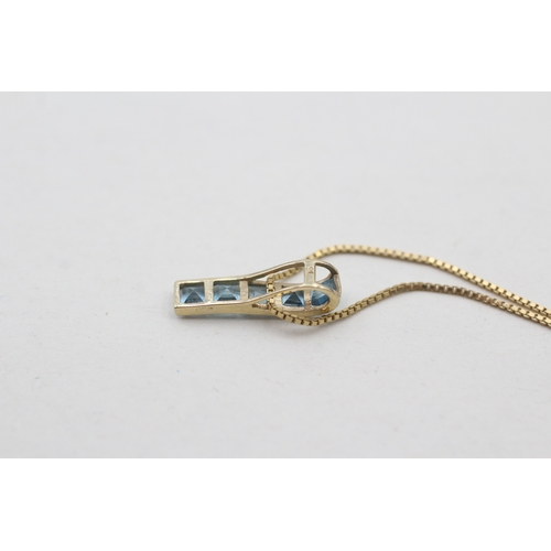 119 - 9ct gold blue topaz set pendant necklace (1.8g)