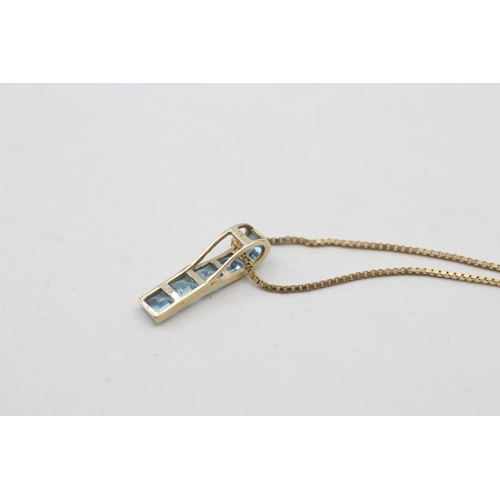 119 - 9ct gold blue topaz set pendant necklace (1.8g)