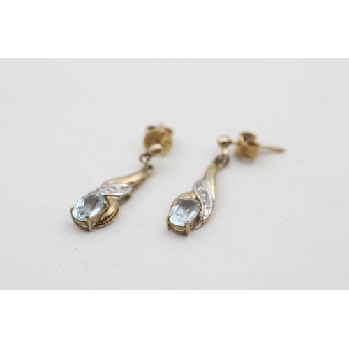 121 - 9ct gold diamond and blue topaz set drop earrings (2g)